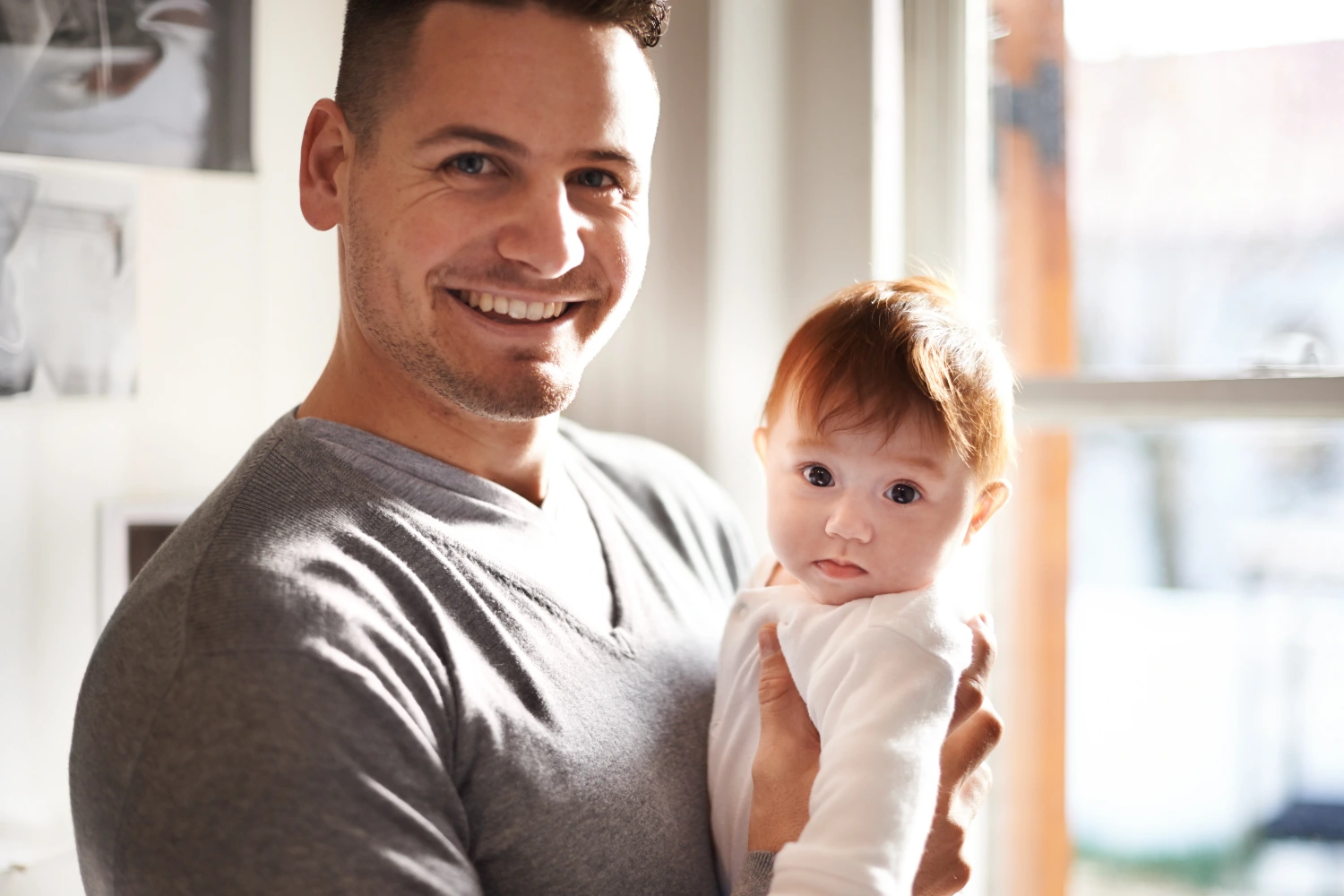 Dad holding a young baby