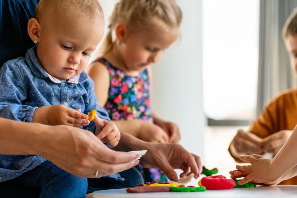 Toddlers playing with toys