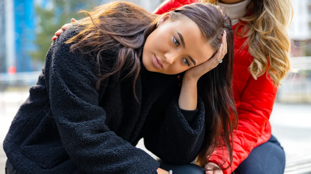 Friend consoling unhappy woman